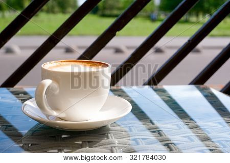 Cappuccino In White Cup On Table At Cafe. Copyspace. Bewerages, Coffee Lovers And Morning Menu Conce
