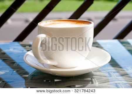 Cappuccino In White Cup On Table At Cafe. Copyspace. Bewerages, Coffee Lovers And Morning Menu Conce