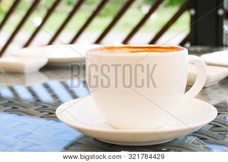 Cappuccino In White Cup On Table At Cafe. Copyspace. Bewerages, Coffee Lovers And Morning Menu Conce