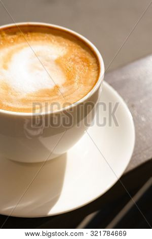 Cappuccino In White Cup On Sunlight At Cafe. Copyspace. Bewerages, Coffee Lovers And Morning Menu Co