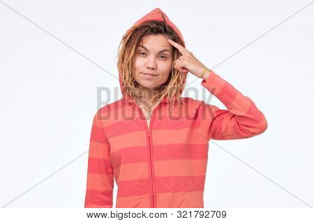 Ethnic Young Woman With Dreadlocks In Hood Having A Great Idea