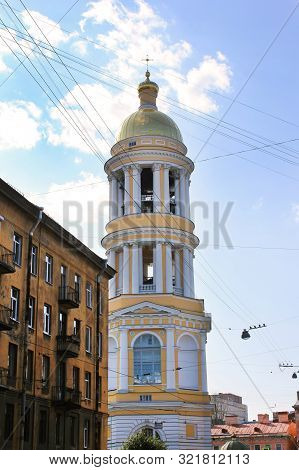 Bell Tower Of Vladimirskaya Church And Old House Facade On The Street Of Saint Petersburg City, Russ