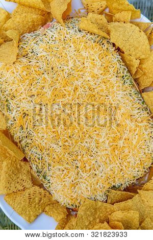 Tortilla Chips With 7 Layer Bean Dip For Outdoor Picnic Party Appetizer