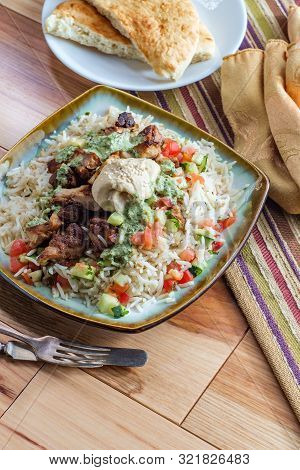 Authentic Middle Eastern Chicken Shawarma Rice Platter With Hummus And Side Salad