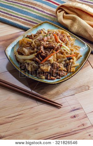 Stir Fried Chinese Beef Chow Fun With Hor Fun Wide Rice Noodles Cabbage And Carrots