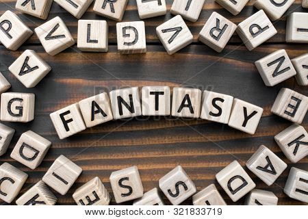 Fantasy - Word From Wooden Blocks With Letters, Literary Genres Concept, Random Letters Around, Top 