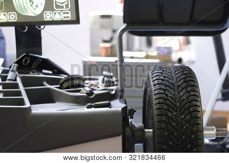 Mosocw, Russia - September, 6, 2019: the image of a tyre repair machine in a car repair station in Mosocw, Russia
