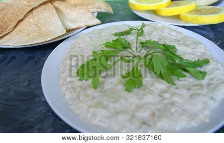 Famous Traditional Arabic Cuisine - Dip Baba Ganoush With Pita Bread And Fresh Lemon On Grey Backgro