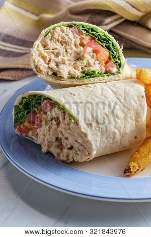 Tuna Salad Wrap Sandwich With French Fried Potatoes