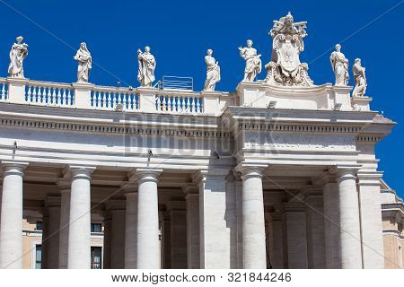 Detail Of The Chigi Coats Of Arms And The Statues Of Saints That Crown The Colonnades Of St. Peter S