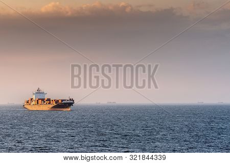 Manila, Philippines - March 5, 2019: Evening Twilight Shines On Black And Red Seaspan Ningbo Contain