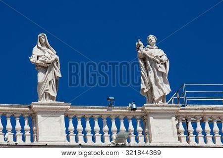 Detail Of The Statues Of Saints That Crown The Colonnades Of St. Peter Square Built On 1667 On The V