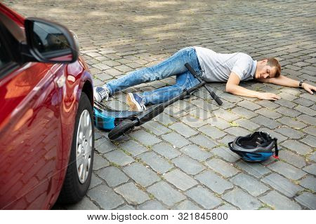 Man After Accident On Electric Scooter Overrun By Car