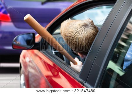 Angry Driver With Baseball Bat Screaming Out Of Car Window
