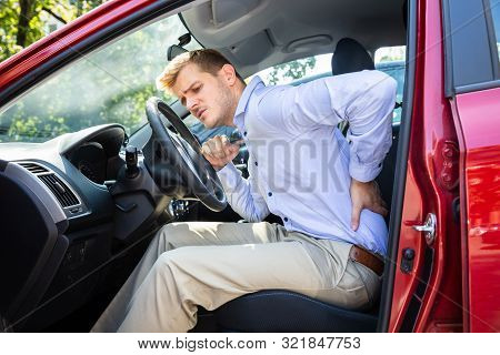 Driver Standing Having Backpain After Driving Car
