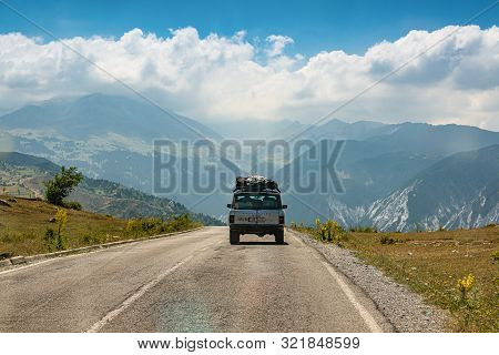 Kolesjan, Albania - July 25, 2019. Vintage Off Road Car Heading To The Mountain In National Park Lur