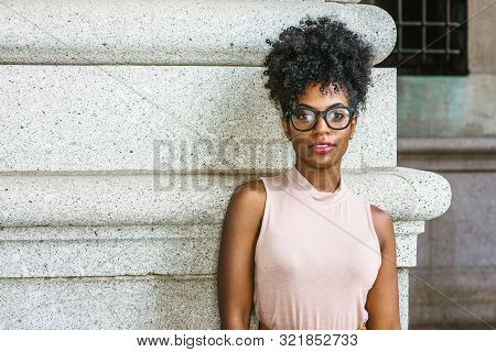 Portrait Of Young African American Woman In New York. Young Black Female College Student With Afro H