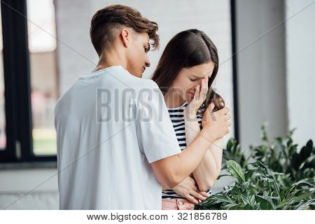 Teen Boy In White T-shirt Supporting Crying Friend