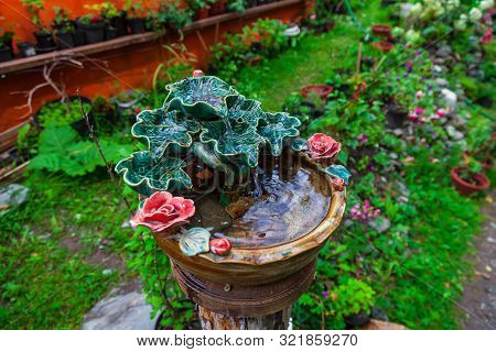 A Beautiful Small Decorative Fountain Made Of Porcelain Or Clay Molded In The Form Of Green Leaves A