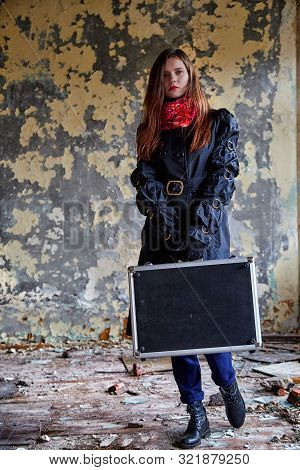 Girl In A Black Cloak With A Diplomat In A Ruined Room. A Spy In A Secret Meeting. Unusual Photo Sho