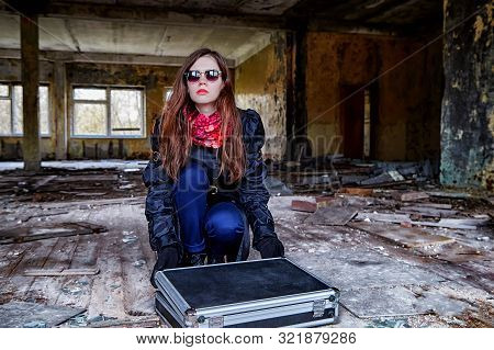 Girl In A Black Cloak With A Diplomat In A Ruined Room. A Spy In A Secret Meeting. Unusual Photo Sho