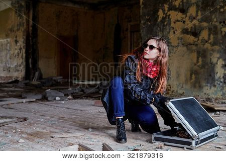 Girl In A Black Cloak With A Diplomat In A Ruined Room. A Spy In A Secret Meeting. Unusual Photo Sho