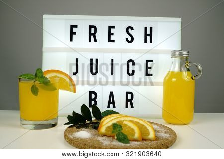 Fresh Juice Bar Concept. Oranges With Fresh Orange Juice