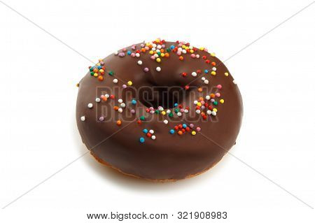 Sweet Doghnut In Cacao Glaze Decorated With Sprinkles Isolated On A White Background