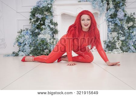 Sensual Woman In Latex Costume In The Studio. Hot Plus Size Fetish Adult Girl In Rubber Catsuit. Who