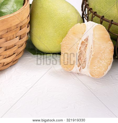 Fresh Peeled Pomelo, Pummelo, Grapefruit, Shaddock On Bright Wooden Table Background. Seasonal Fruit
