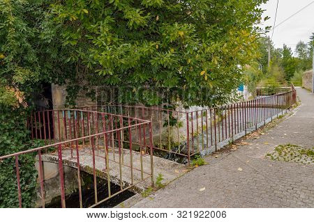 Small Footbridge To The Entrance Of A House On The River Of The Tone In The City Of Virton In The Pr