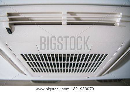 Roof Mount Rv Air Condition Unit. Modern Heating And Cooling Device Inside Travel Trailer.