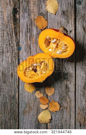 Ingredients For Cooking Pumpkin Risotto. Raw Uncooked Risotto Rice In Ceramic Bowl, Sliced Pumpkin, 