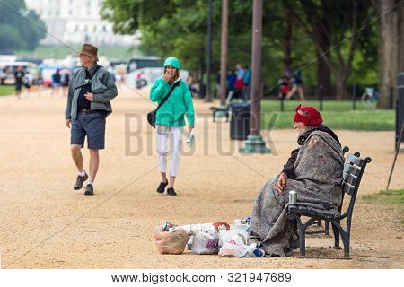 Washington Dc, Usa - June 9, 2019: Visitors To Dc Go For A Stroll Along The National Mall. A Homeles