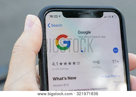 Moscow, Russia - September 01, 2019: Hand Holding A Smartphone With Google Application Icon On Scree