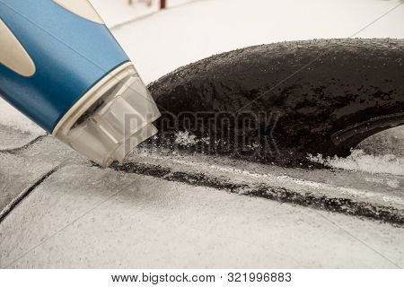 Icy Car Body And A Door That Cannot Be Opened After Freezing Rain. Warming Up Using Hairdryer. Probl