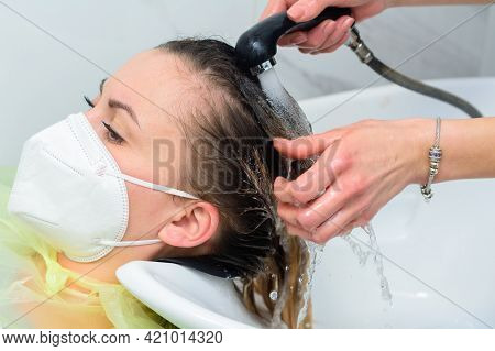 The Hairdresser Washes Off The Hair Dye, Scalp Wash And Hair Dyeing Process.