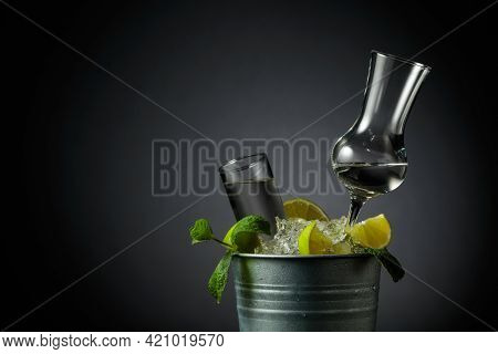 Strong Alcoholic Drink With Lime And Mint In A Metal Bucket With Ice. Grey Background With Copy Spac