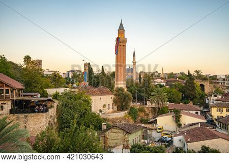 Antalya, Turkey - October 11, 2020: Historic clock tower and Yivli minaret in Kaleici old town of Antalya, Turkey