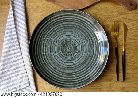 Plate On The Table. Empty Plate With Cutlery On The Table, Fork, Knife, Plate. Cutlery On The Table.