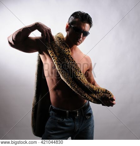 The Sexy Man Poses For The Photo Without A Shirt On.