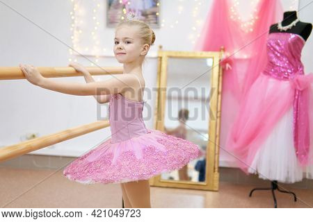 Little ballerina training. Children dance ÃÂlassical ballet in studio.