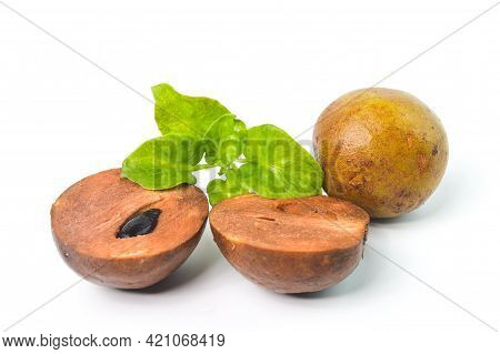 Sapodilla Fruit With Green Leaves Isolated On A White Background