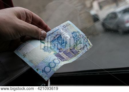 Azerbaijan, Baku - Nowember 2009: Man Hand With Manat Isolated On Black Background, Hand Holding Out