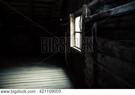 Horror Background Causing Fear. Scary Mystical Mysterious Dark Attic Room In An Abandoned Wooden Old