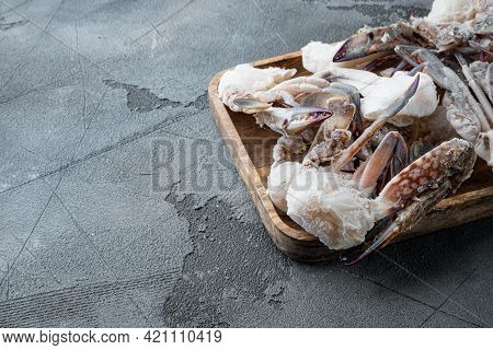 Frozen Raw  Blue Swimming Crab Parts Set, On Wooden Tray, On Gray Background , With Copyspace  And S