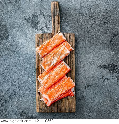 Fresh Crab Meat Stick Surimi With Blue Swimming Crab Set, On Wooden Cutting Board, On Gray Backgroun