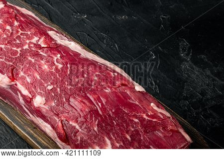 Fresh And Raw Beef Meat. Whole Piece Of Tenderloin With Steaks Set, On Black Stone Background, With 