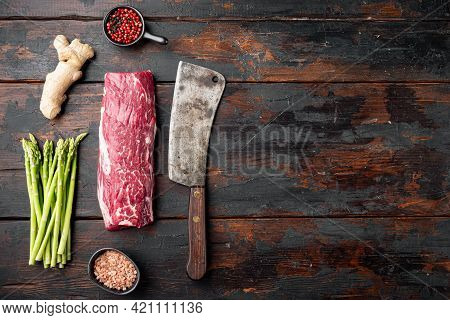 Fresh Raw Beef Steak Mignon Whole Cut Set , With Old Butcher Cleaver Knife, On Old Dark  Wooden Tabl