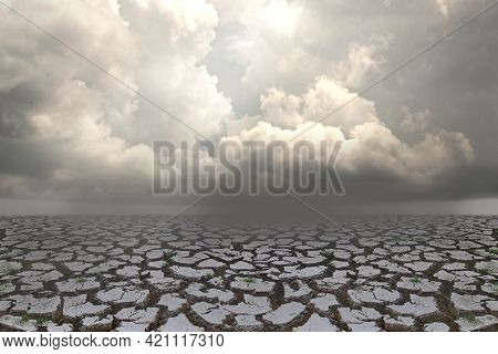 Concept Of Global Warming. Dry Cracks And Water Shortages The Concept Of Drought Due To Inclement We